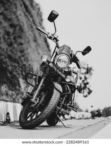 Similar – Senior man steering motorcycle on road