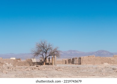 Bike Parket By Remains, Ruins, Of An Abandoned Nitrate City, In The Atacama Desert, Chile. Long Distance Bycycle Adventure