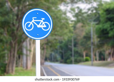 Bike path traffic sign blur background.