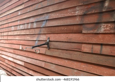  Bike Rack On The Wooden Wall Background In The Horizontal Style