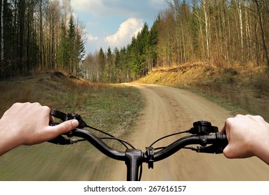 Bike Riding On A Dirt Road. The View From The Driver's Side. First Person View.