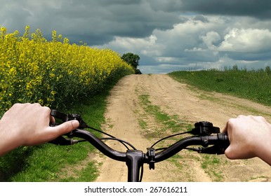 Bike Riding On A Dirt Road. The View From The Driver's Side. First Person View.