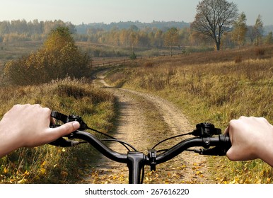 Bike Riding On A Dirt Road. The View From The Driver's Side. First Person View.