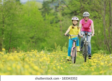 Bike Riding - Young Girl With Mother On Bike, Active Family Concept