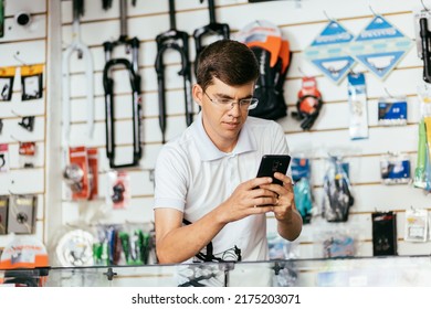 Bike Shop Owner Working In His Shop. Small Business And Entrepreneurship Concept