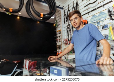 Bike Shop Owner Working In His Shop. Small Business And Entrepreneurship Concept