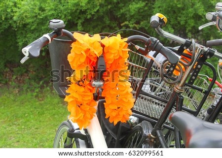Bike steering wheel and orange flower garland decorations for FIFA world cup football matches