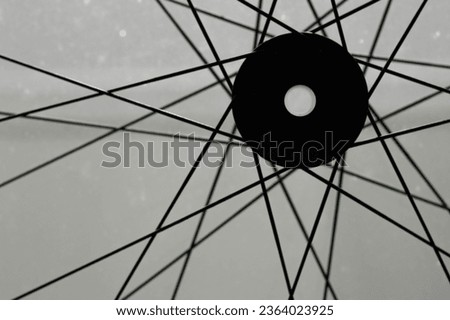 bike wheel spokes against a gray background