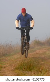 biker in action in winter with a lot of cold