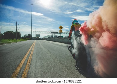 Biker Chick Doing Stunts On Rural Streets