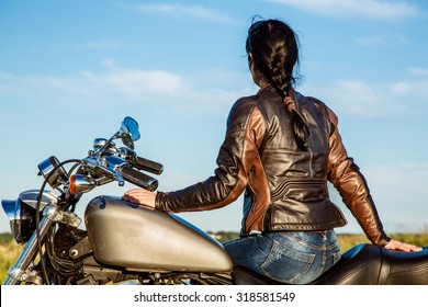 Biker Girl In A Leather Jacket On A Motorcycle