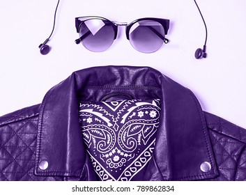 Biker Jacket And Woman Sunglasses With Headphones On Pink Background. Alternative Fashion Set. Flat Lay, Top View. Ultra Violet Color.