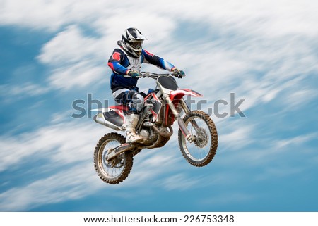 biker making stunt and jumps in the air