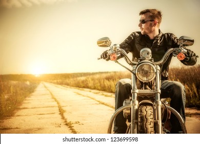 Biker Man Sits On A Bike