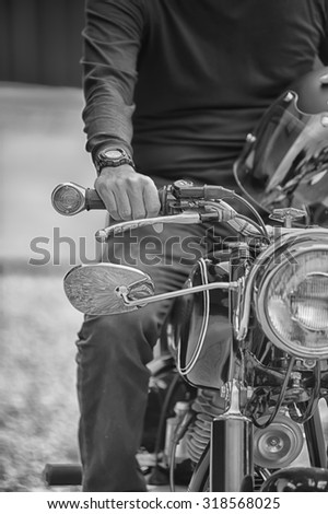 Similar – Couple sitting over motorcycle ready to go