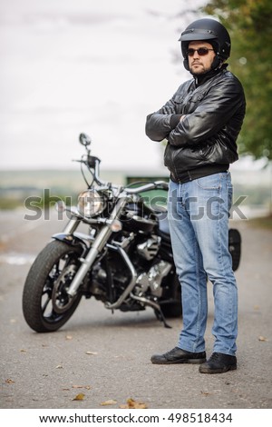 biker-man-standing-his-motorcycle-450w-4