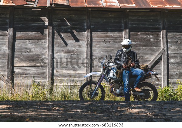 Biker Motorcycle Stands On Road On Stock Photo Edit Now 683116693