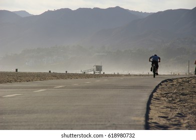 Biker On Bicycle Path In Venice Beach, California