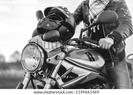 Similar – Senior man repairing damaged motorcycle engine