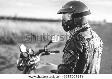 Similar – Senior man steering motorcycle on road