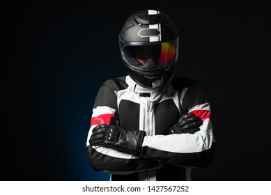 Biker in protective suit with a helmet