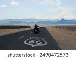 biker riding along legendary route 66