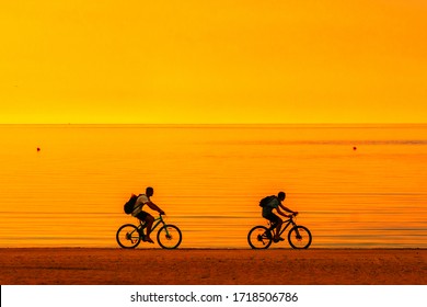 Biker Silhouette Riding Along Beach At Sunset On Bike Sporty Company Group Of Friends On Bicycle Outdoors Success Achievement Accomplishment And Winning Concept With Cyclist Mountain Biking. Copyspace