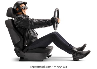 Biker Sitting In A Car Seat And Holding A Steering Wheel Isolated On White Background