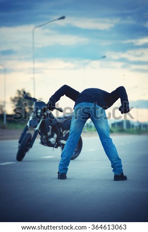 Similar – Couple sitting over motorcycle ready to go