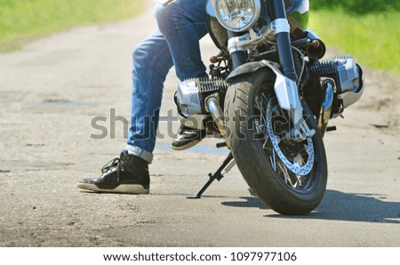 Similar – Image, Stock Photo Couple sitting over motorcycle ready to go