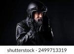 biker with a vintage hipster look with a beautiful look and a beard dressed in a black leather jacket