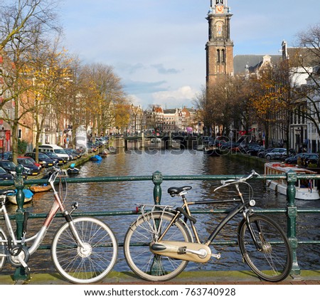 Similar – Foto Bild Architektur niederländischer Häuser Fassade und Hausboote am Amsterdamer Kanal