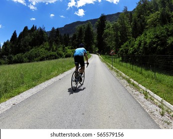 biking in the hills. bicycling in hills and mountains. bicyclist. alone biker. individual training. uphill biking. cycling path. The best biking tours. biking in nature