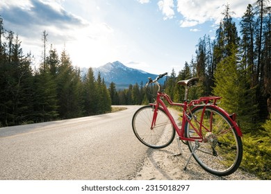 Biking in nature. Scenic bicycle trip along the alpine route. Maligne Lake Road. Jasper National Park, Alberta, Canada.