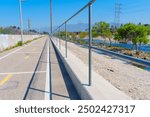 Biking and walking path along the Los Angeles River in Elysian Valley, featuring a well-maintained surface and scenic river views.