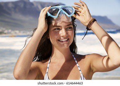 Bikini babe at beach with diving mask