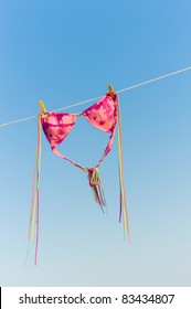Bikini is drying on a line