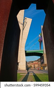 Bilbao, Basque Country, 25/01/2017: The Sculpture Of Ramon Rubial Cavia (1906-1999), President Of Spanish Socialist Workers Party (Psoe) Under La Salve Bridge, The Red Arch Bridge Built In The 1970s