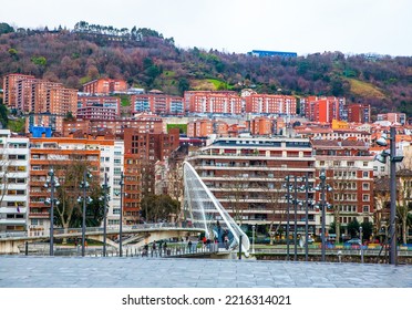 Bilbao, Basque Country, Spain - January 25, 2019: People Are Crossing Zubizuri Bridge In Bilbao