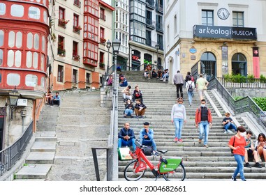 Bilbao, Basque Country, Spain - July 6, 2021: Young People With And Without Masks Enjoy Time Outside On The Street During Covid Pandemic