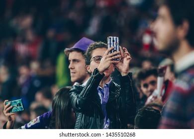 Bilbao, Spain. 06th May, 2019. Pais Vasco. San Mamés. Liga Santander. Athletic Bilbao V Real Valladolid CF: A Real Valladolid Fan Taking A Photo At San Mamés Stadium.