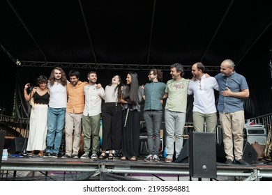 Bilbao, Spain - Jul. 23, 2022: All The Musicians Of The Folk Fusion Music Group Kuttune, Greet The Audience After A Concert At The Local Festivities In Echevarri