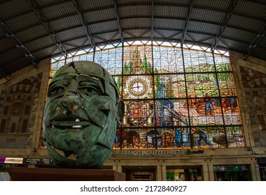 Bilbao, Spain. June 22nd 2022. Bilbao Train Station, Stained Glass Window. Inside View Of This Bright Cinematic Style Historical Building. With Commissioned Window And Head Statue In The Foreground 