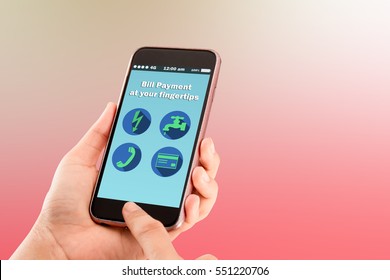 Bill Payment At Your Finger Tips.hands Holding Smartphone On Blurred Abstract Background