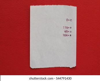 Bill Or Receipt Over Bright Red Paper Background