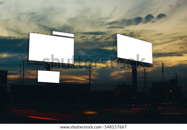 billboard blank for outdoor advertising\
poster or blank billboard at night time for advertisement.\
billboard at the twilight, light car, street\
light