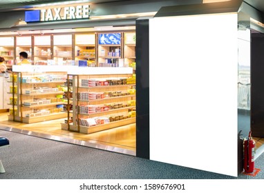 Billboard, blank white banner at duty-free shops inside the airport with on-screen cutting paths - can be used to display your products or promotions.