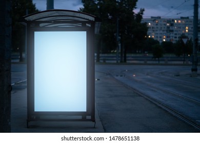 Billboard At The Bus Stop Outdoor Ad.bus Shelter With White Field Glowing At Night In The City Mockup Advertisement.