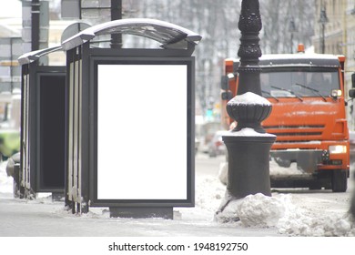 Billboard At The Bus Stop Screen. With Snow In Winter.