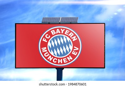 Billboard With FC Bayern Munich Flag And Solar Battery On Blue Sky Background